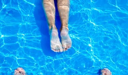 young-womans-legs-in-swimming-pool-summer-heat-2