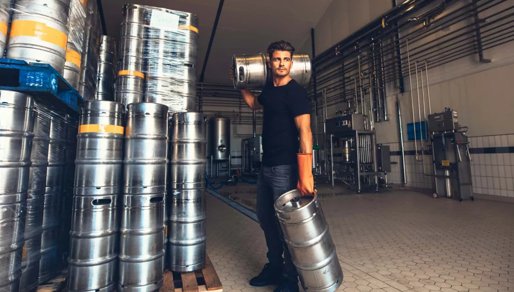 brewer-carrying-keg-at-brewery-factory-2
