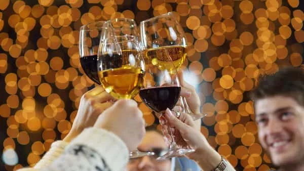 hands-holding-the-glasses-of-champagne-and-wine