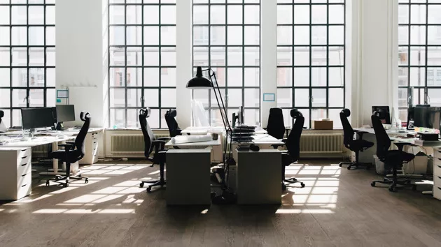 empty-table-and-chair-against-window-at-new-workplace-2