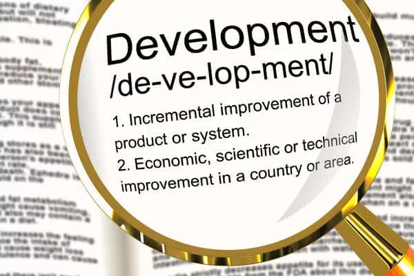 development-definition-magnifier-showing-improvement-growth-or-advancement