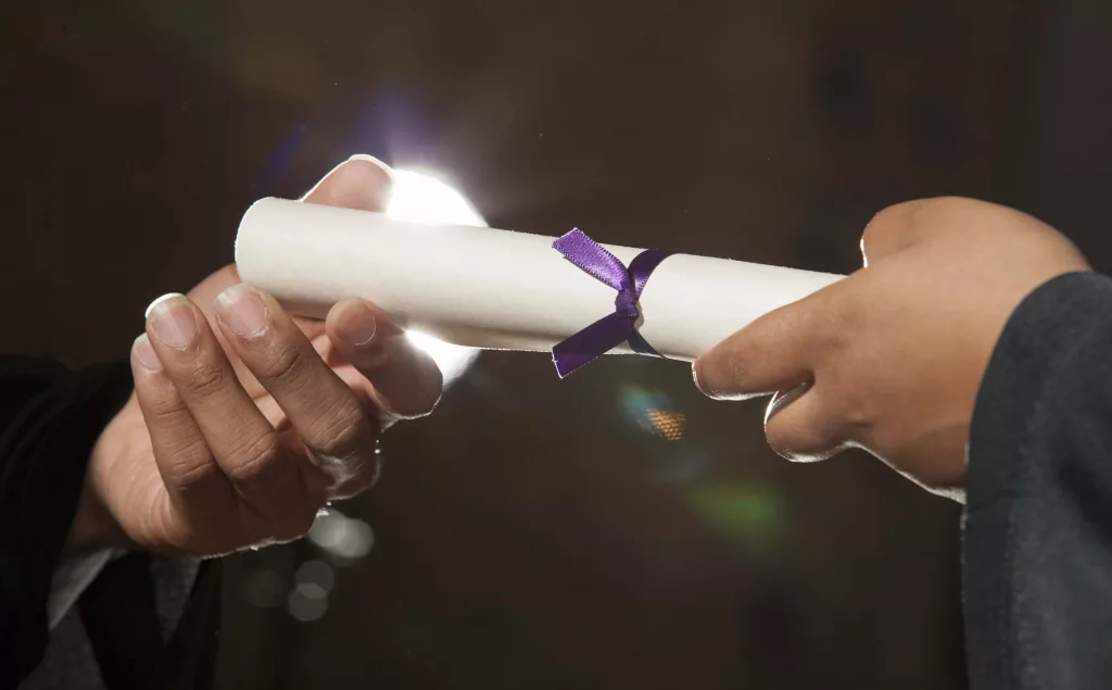 diploma-in-hands-at-graduation-ceremony-4