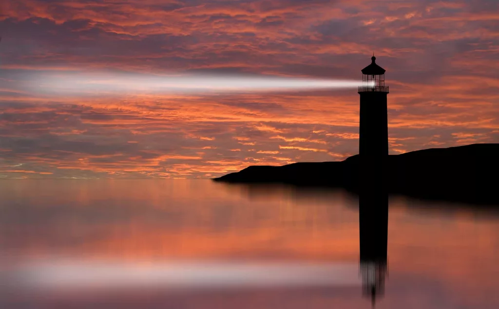 lighthouse-searchlight-beam-through-marine-air-at-night