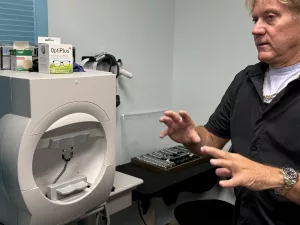 Dr. Flood shows equipment in his office.