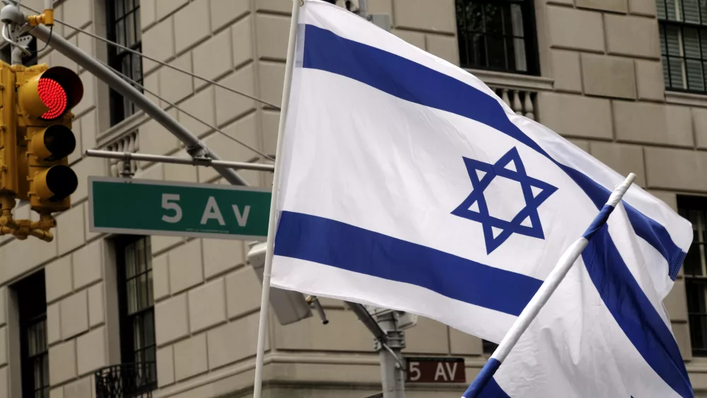 MANHATTAN, UNITED STATES - June 5, 2011: Israeli flags wave high above 5th Avenue during the Celebrate Israel Parade.