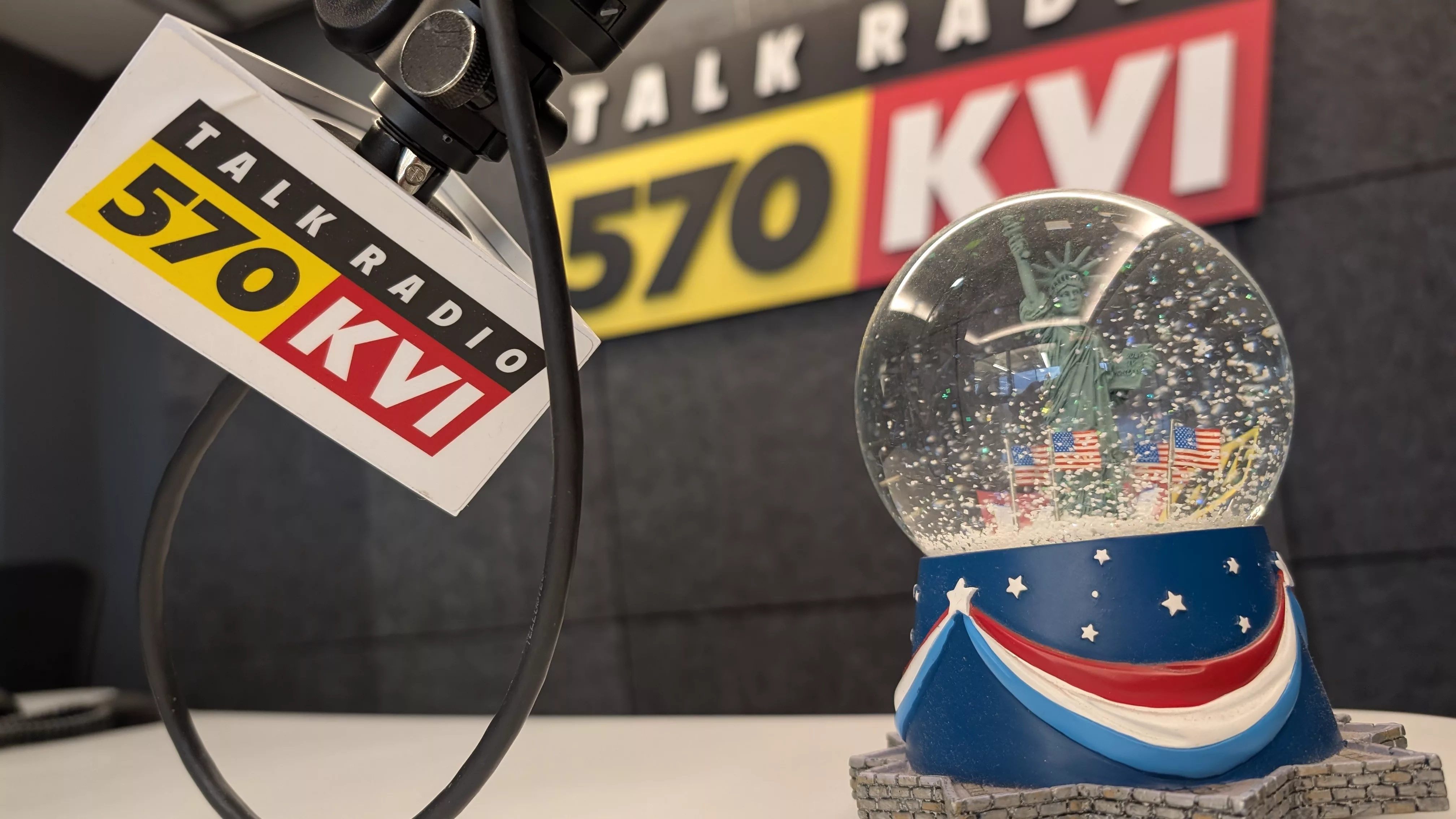 KVI, logo, mic flag, snow globe, Lady Liberty