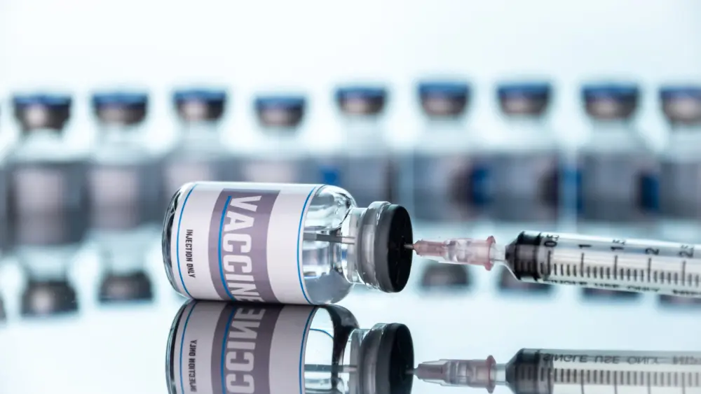 Glass vials for vaccine and syringe in laboratory. Group of vaccine bottles. Medicine in ampoules.