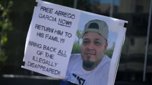 protest sign reading: "Free Abrego Garcia Now" Return Him To his family! Bring back all of the illegally disappeared! NEW YORK^ NEW YORK USA - May 1^ 2025 on International Workers' Day in Lower Manhattan.