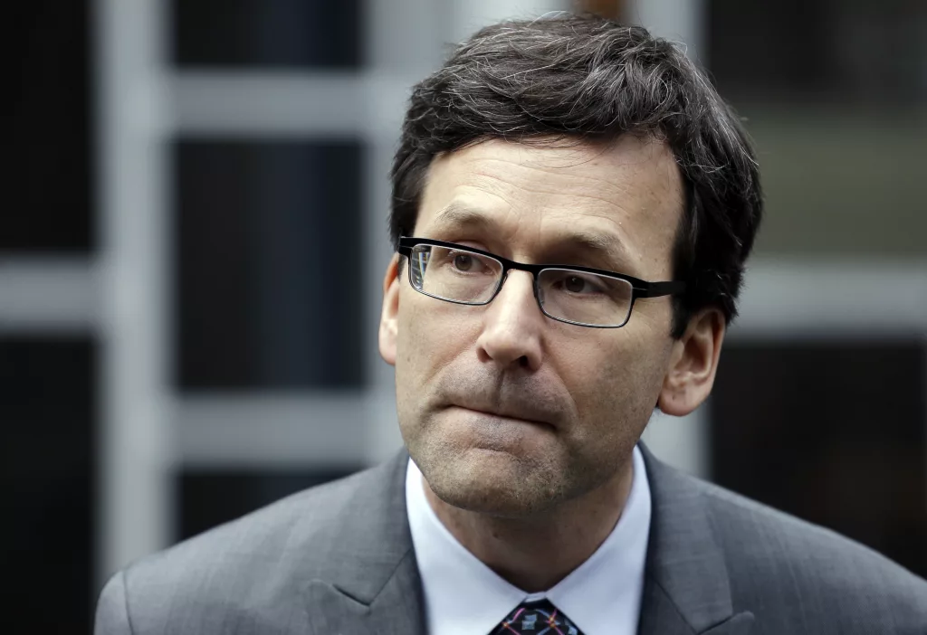 Attorney General Bob Ferguson listens to a question as he speaks with media members on the steps of the federal courthouse after an immigration hearing there Wednesday, March 15, 2017, in Seattle. Hours before it was to take effect, President Donald Trump's revised travel ban was put on hold Wednesday by a federal judge in Hawaii who questioned the government's argument that the measure was motivated by national security concerns. In a new court filing Wednesday, Ferguson said the state supports the arguments made in a related case filed by an immigrant rights group based in Seattle that alleges the ban discriminates against Muslims and violates federal immigration law. (AP Photo/Elaine Thompson)