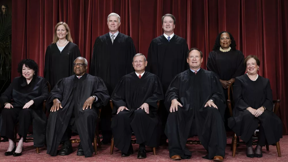 FILE - Members of the Supreme Court sit for a new group portrait following the addition of Associate Justice Ketanji Brown Jackson, at the Supreme Court building in Washington, Oct. 7, 2022. Bottom row, from left, Associate Justice Sonia Sotomayor, Associate Justice Clarence Thomas, Chief Justice of the United States John Roberts, Associate Justice Samuel Alito, and Associate Justice Elena Kagan. Top row, from left, Associate Justice Amy Coney Barrett, Associate Justice Neil Gorsuch, Associate Justice Brett Kavanaugh, and Associate Justice Ketanji Brown Jackson. (AP Photo/J. Scott Applewhite, File)