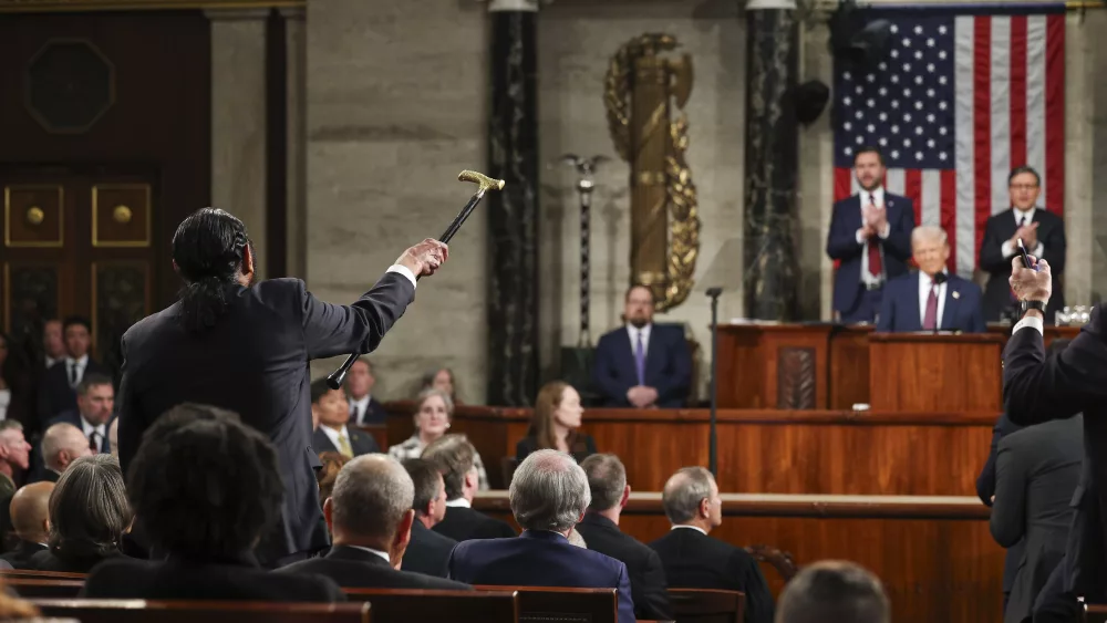 Rep. Al Green, D-Texas, left, shouts as President Donald Trump addresses a joint session of Congress at the Capitol in Washington, Tuesday, March 4, 2025. (Win McNamee/Pool Photo via AP)