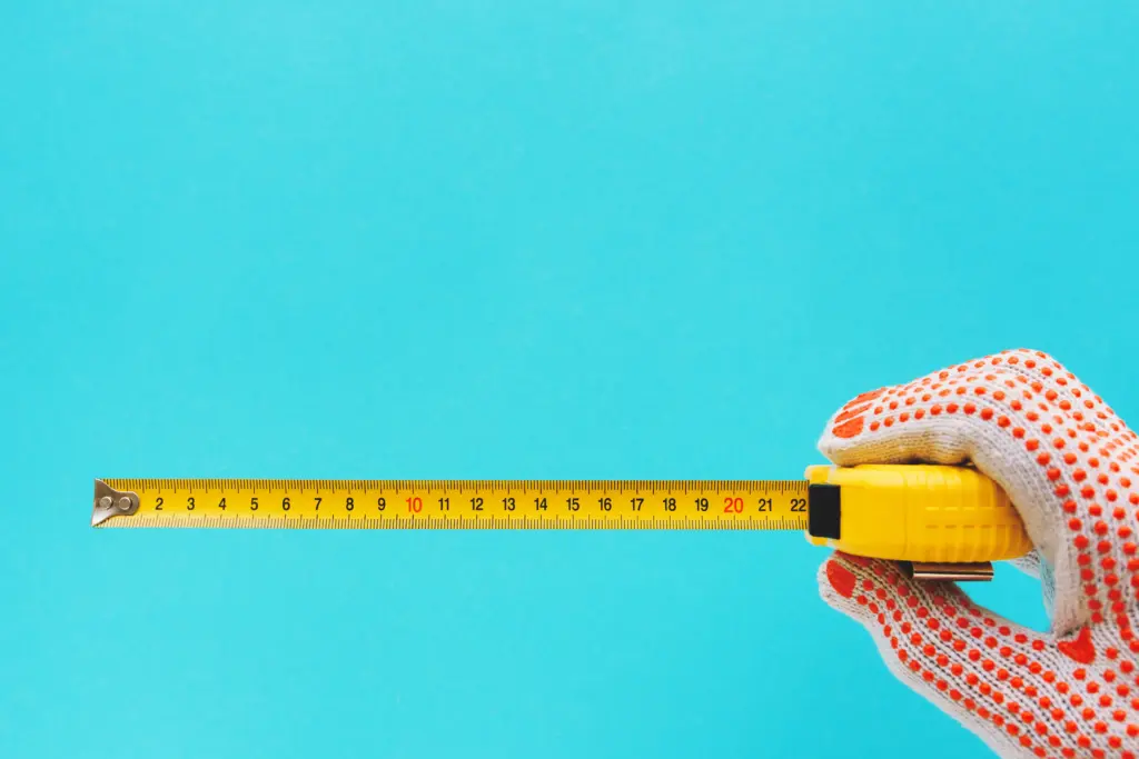 handyman-measuring-size-with-tape-meter
