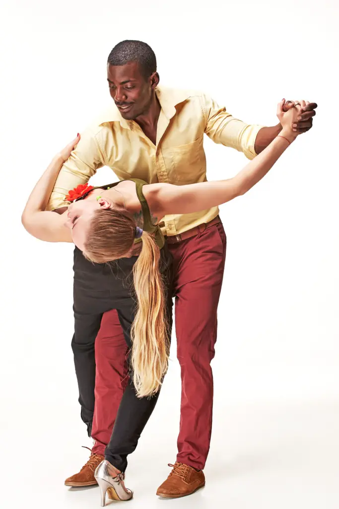 young-couple-dances-caribbean-salsa-studio-shot