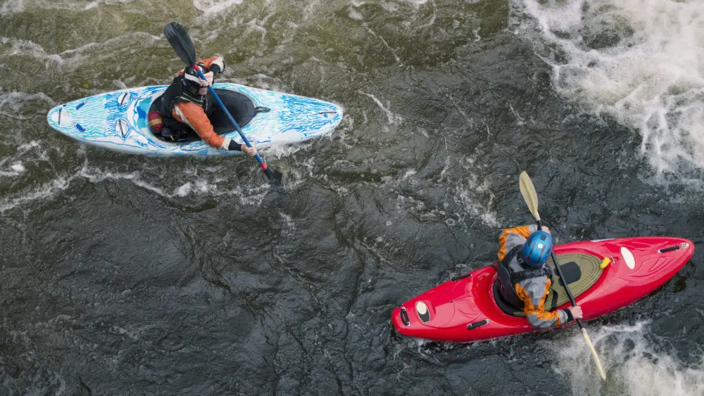 overhead-view-of-two-kayakers-paddling-river-dee-rapids