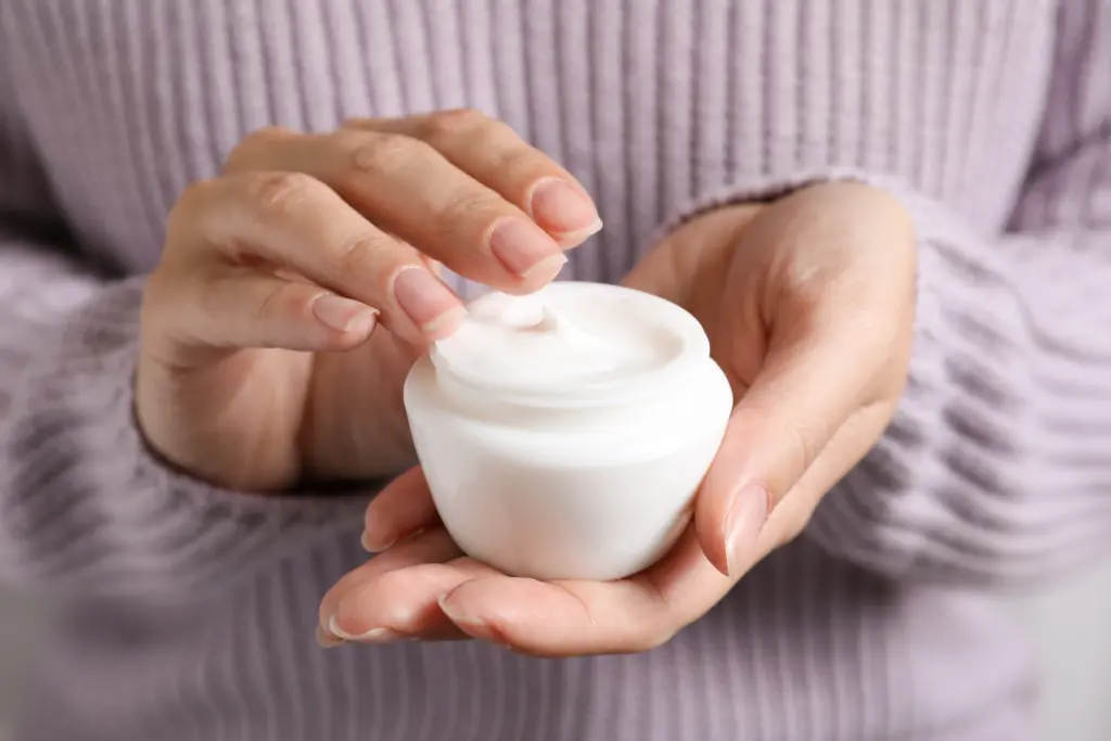 woman-holding-jar-of-moisturizing-cream-closeup-winter-skin-care-cosmetic