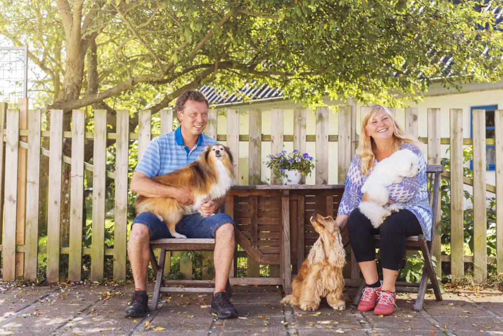 portrait-of-man-and-woman-with-dogs