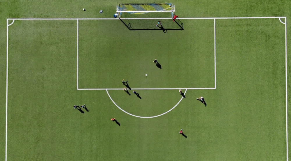 soccer-players-on-a-green-sports-field
