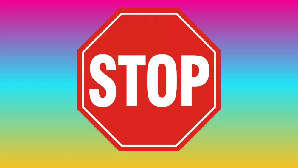 A stop sign on a colorful background.