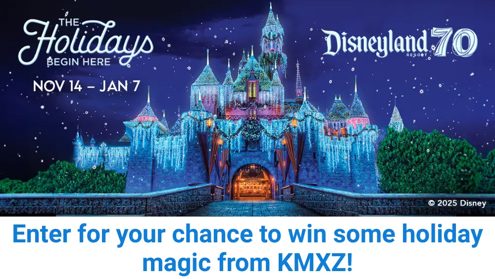 Sleeping Beauty Castle illuminated with sparkling holiday lights and snowflake decorations during Disneyland Resort’s 70th Anniversary celebration, promoting KMXZ’s holiday giveaway running Nov 14 to Jan 7.