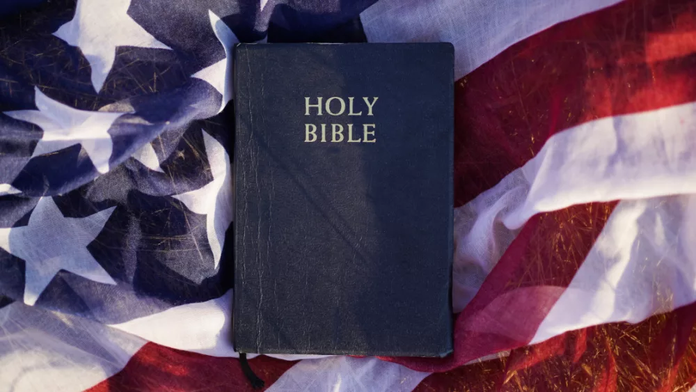 29451-american-flag-bible-gettyimages-anastasiia-st_source_file445692