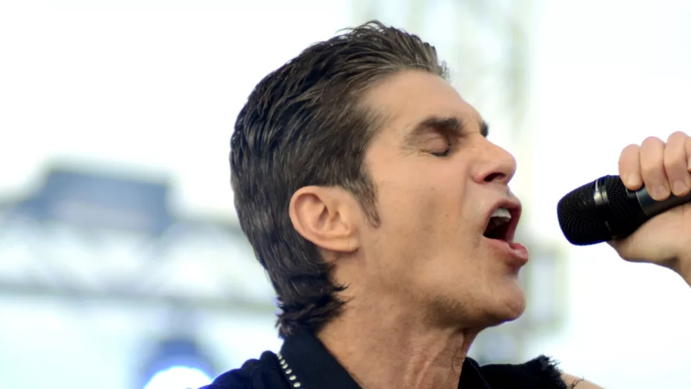 singer Perry Farrell performs at an outdoor concert in Indiana.