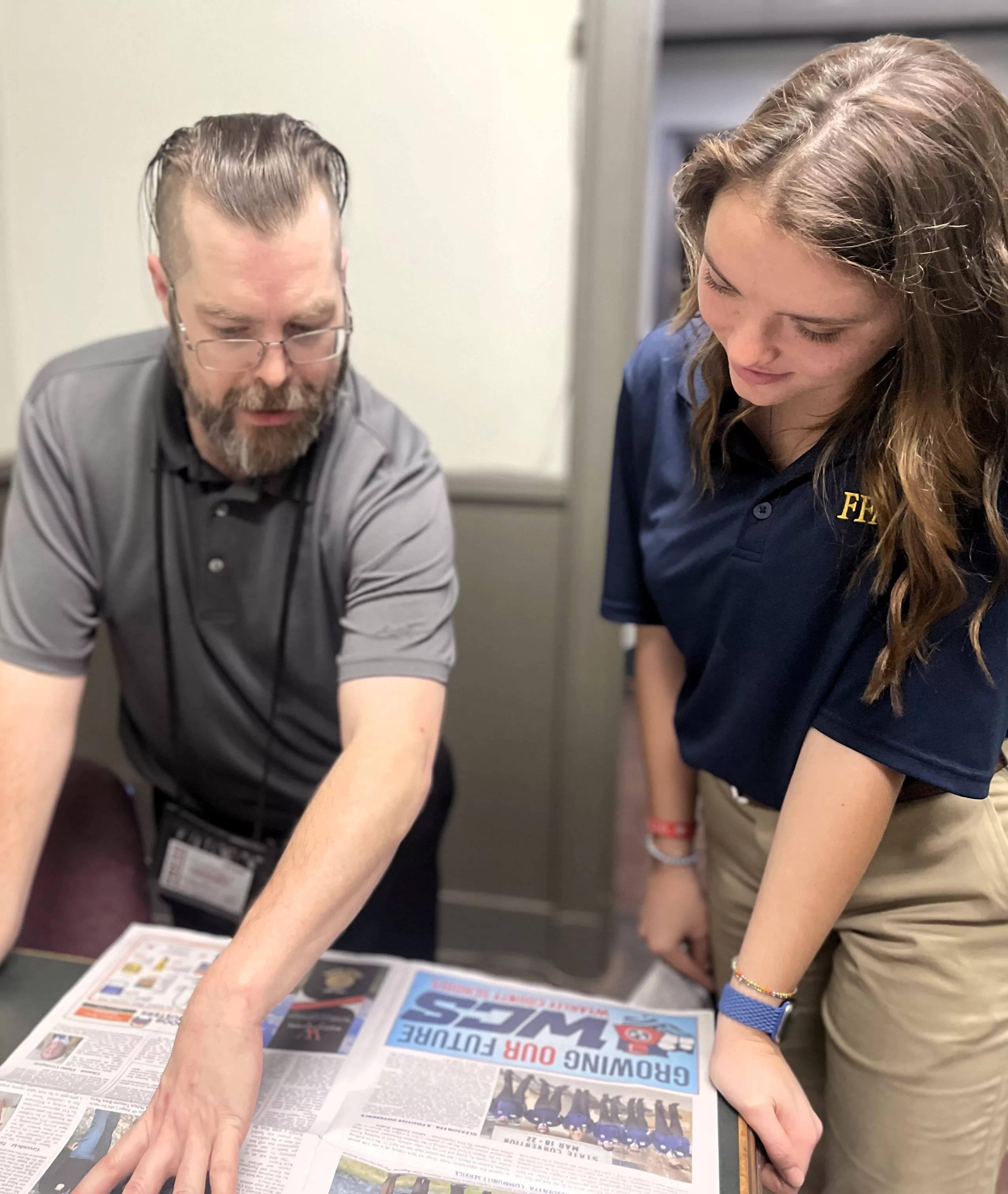 lemons-and-brundige-discuss-ffa-section-layout-at-office-of-weakley-county-press