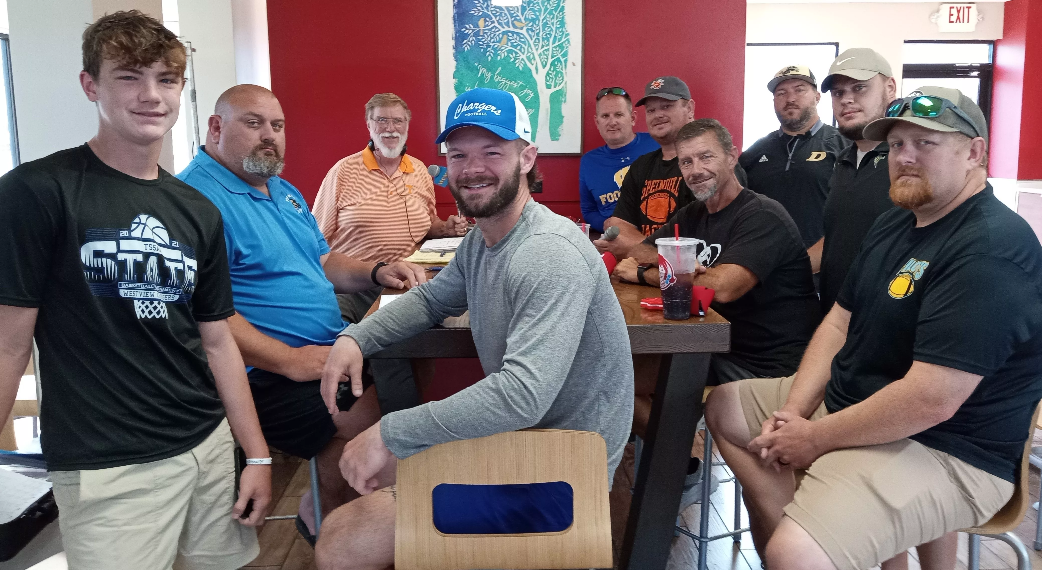 Host Paul Tinkle with area coaches and guests at the season premiere of "Coaches Corner" at Wendy's in Martin on Aug. 17, 2024.