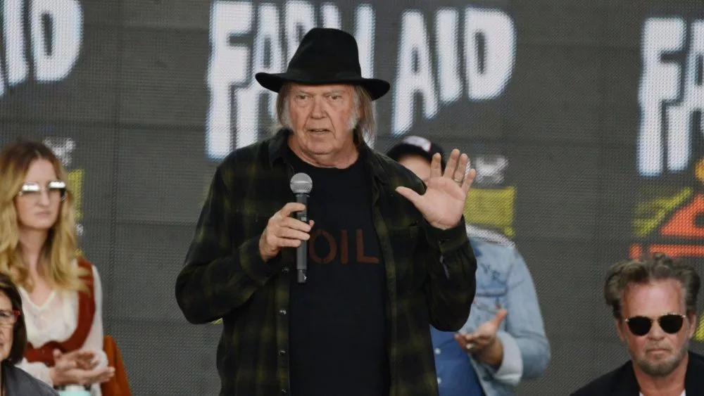 Neil Young talks onstage at the 2018 Farm Aid press conference. Hartford^ CT - September 22^ 2018