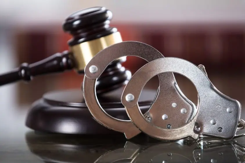 close-up-of-handcuffs-and-gavel