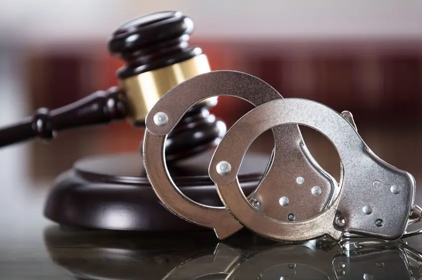 close-up-of-handcuffs-and-gavel
