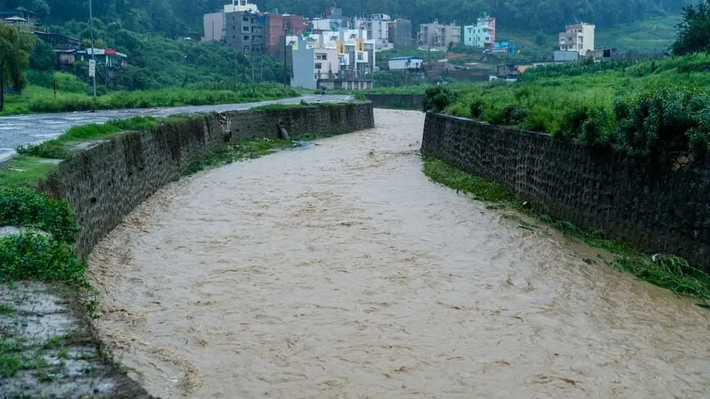 KATHMANDU^ NEPAL - July 06^ 2024: Due to heavy rainfall^ the Nakhu River flood in Kathmandu.