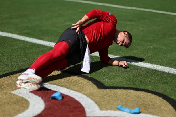 brock-purdy-of-the-san-francisco-49ers-stretches-as-he-warms-up-prior-to-an-nfl-football-game21015