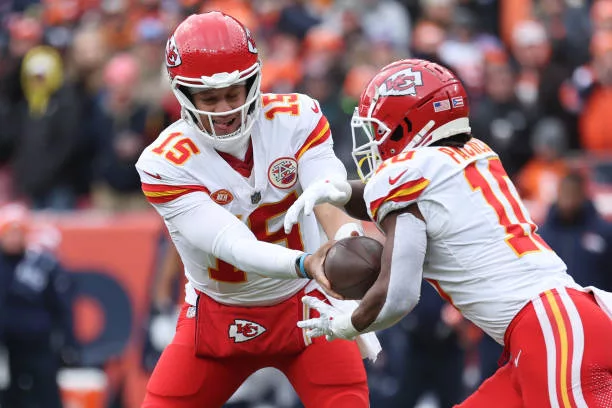 denver-colorado-patrick-mahomes-of-the-kansas-city-chiefs-hands-the-ball-off-to-isiah-pacheco697658