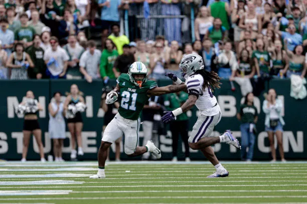 new-orleans-louisiana-makhi-hughes-of-the-tulane-green-wave-stiff-arms-jordan-riley-of-the160635