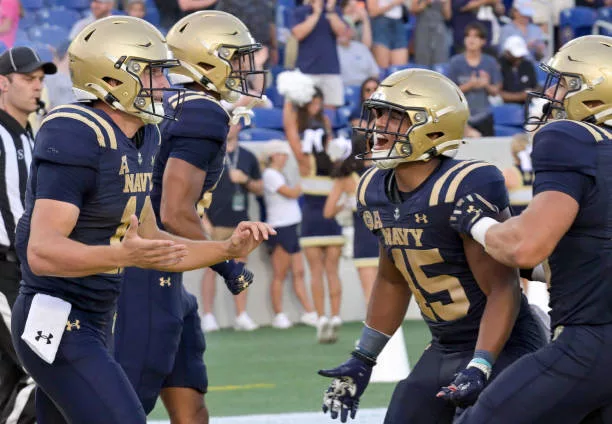 annapolis-md-navy-midshipmen-quarterback-blake-horvath-celebrates-a-score-with-fullback-daba981127