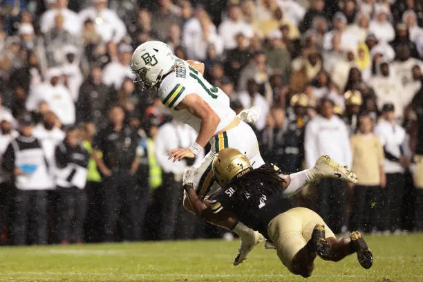 boulder-colorado-sawyer-robertson-of-the-baylor-bears-is-tackled-by-camron-silmon-craig-of6837