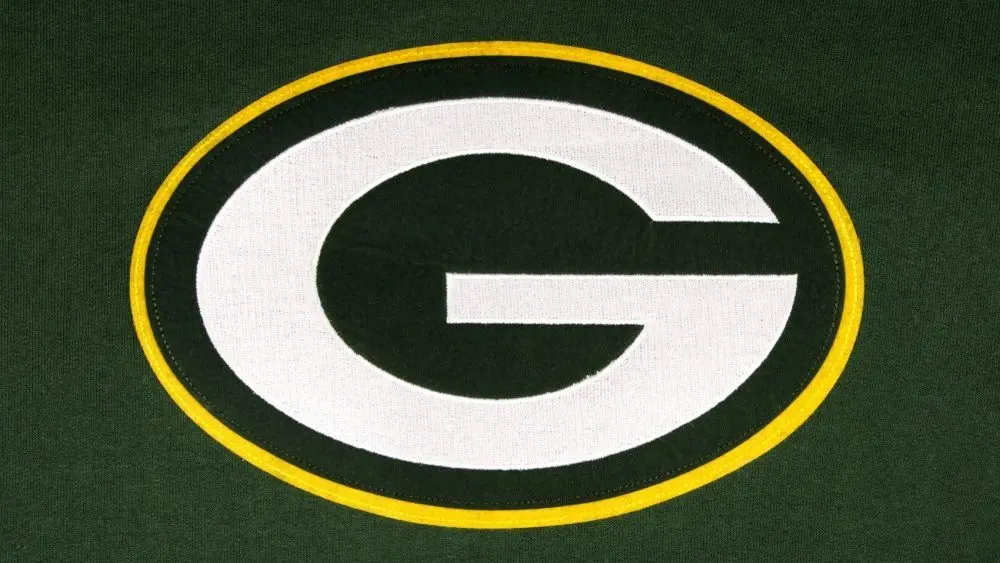 The Green Bay Packers emblem on a team sweatshirt. GREEN Background