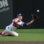20250602-1abaseball-super-04: Pawnee right fielder Lucas Size (4) makes a diving catch in the sixth inning against Walltonville-Sesser-Valier during the 1A baseball super-sectional at Itchy Jones Stadium in Carbondale on Monday. Pawnee came back to win 5-4.
