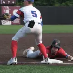 20250602-1abaseball-super-05: Waltonville-Sesser-Valier’s Brandon Messner (10) slides into third base with a triple as Pawnee third baseman waits for the throw in the fifth inning during the 1A baseball super-sectional at Itchy Jones Stadium in Carbondale on Monday. Pawnee came back to win 5-4.