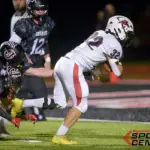 Fairfield’s Logan Tullis (32) eyes the end zone during the first quarter against Johnston City on Friday, Oct. 3, in Johnston City. Photo by Byron Hetzler