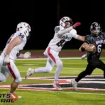 Johnston City quarterback Kaden Koenig (6) is pressured by Fairfield’s Lane Robson (88) during the second quarter on Friday, Oct. 3, in Johnston City. Photo by Byron Hetzler