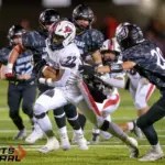 Fairfield’s Michael Barner (22) picks up yardage as he breaks through the Johnston City defense during the first quarter on Friday, Oct. 3, in Johnston City. Photo by Byron Hetzler
