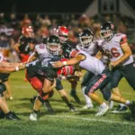 West Frankfort running back Chris Samples is drug down by his jersey against Du Quoin. Photo by Hunter Whitecotton/Southern Focus Photography