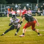 Du Quoin's Jeremiah Jones (#2) jukes West Frankfort defender Chris Samples (#15) on his way to a 70-yard touchdown reception. Photo by Hunter Whitecotton/Southern Focus Photography