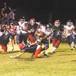 Du Quoin senior Johnathan Brown (#1) stiff arms a West Frankfort defender before scoring what turned out to be the winning touchdown in OT. Photo by Hunter Whitecotton/Southern Focus Photography