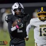 Carbondale’s Javion Oliver (2) outruns Marion’s Andre Jones (13) on a 90-yard touchdown reception during the second quarter on Friday, Oct. 17, in Carbondale.