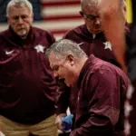 Benton head coach Ron Winemiller game plans with his team during a late 4th quarter timeout. The Rangers beat Murphysboro 54-47. (Photo by Hunter Whitecotton/Southern Focus Photography)