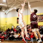 Murphysboro's Cash Brooks hit set back mid range over Benton defender Drake Porter. (Photo by Hunter Whitecotton/Southern Focus Photography)