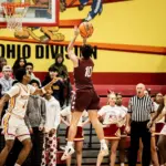 Benton's Clay Gage hits running floater in front of Murphysboro's DaeJohn Beard. (Photo by Hunter Whitecotton/Southern Focus Photography)