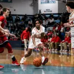 Murphysboro's Airrion Swansey Jr with the bounce pass Myles Guthman. Photo by Hunter Whitecotton/Southern Focus Photography